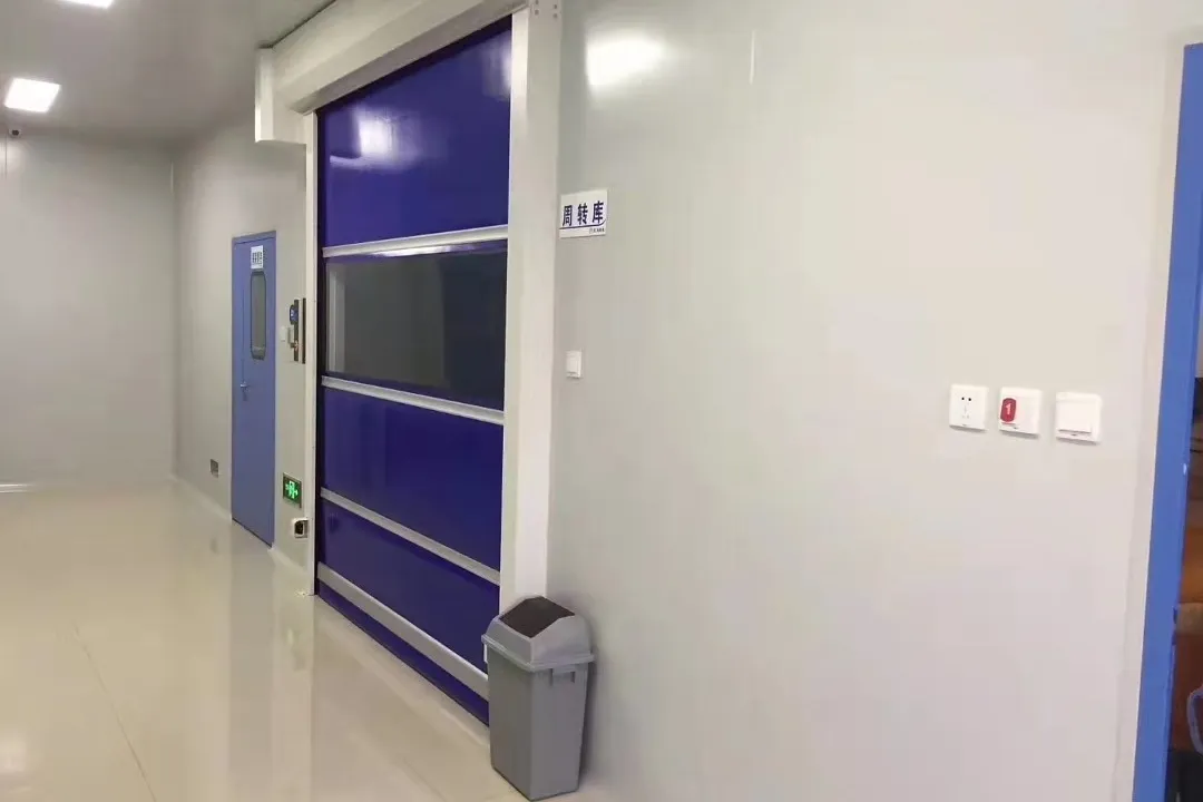 Material transfer route with high-speed roll door